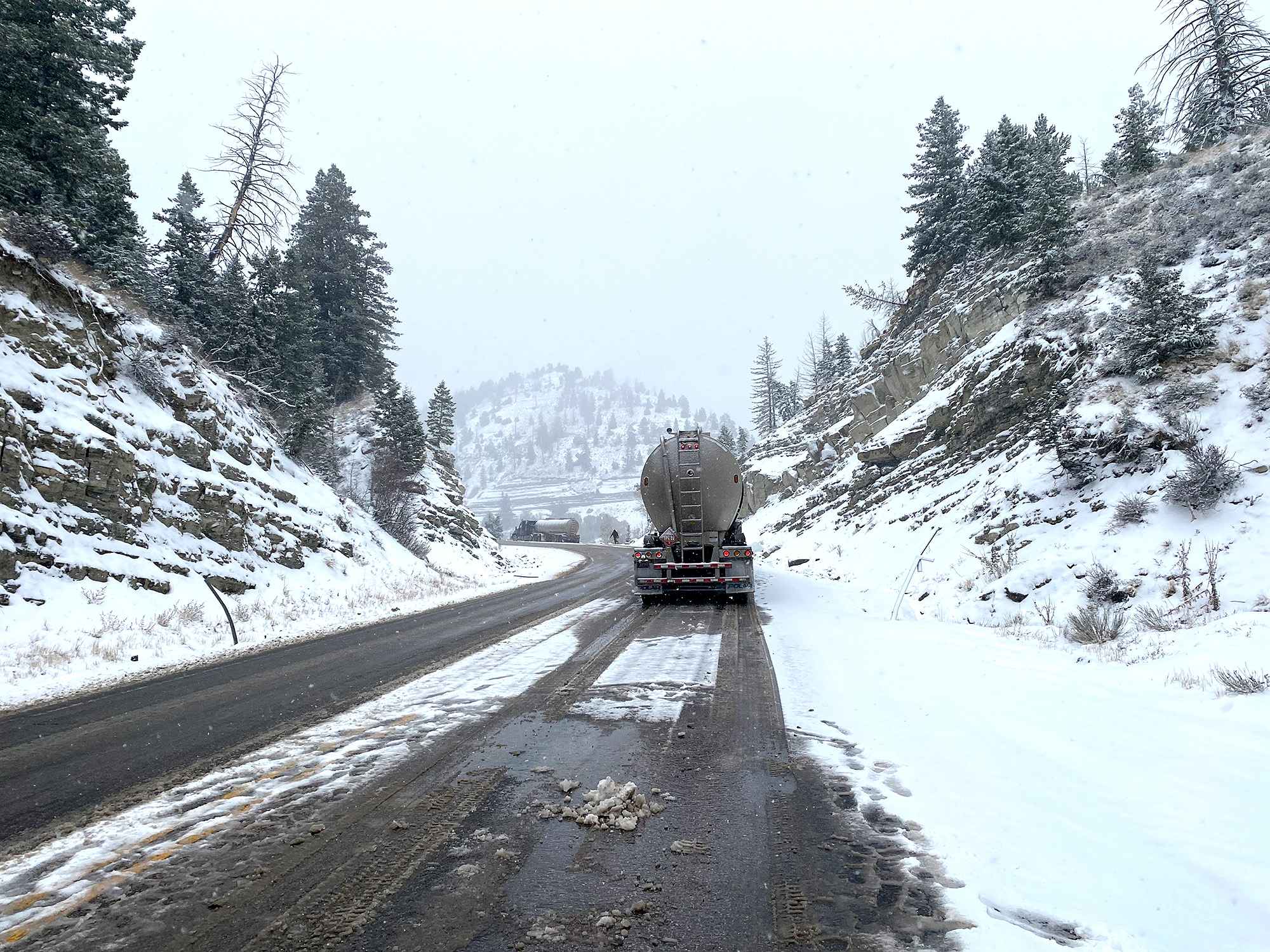 On a snowy day in October, truckers struggled to make it through a mountain pass. On a snowy day in October, truckers struggled to make it through a mountain pass.