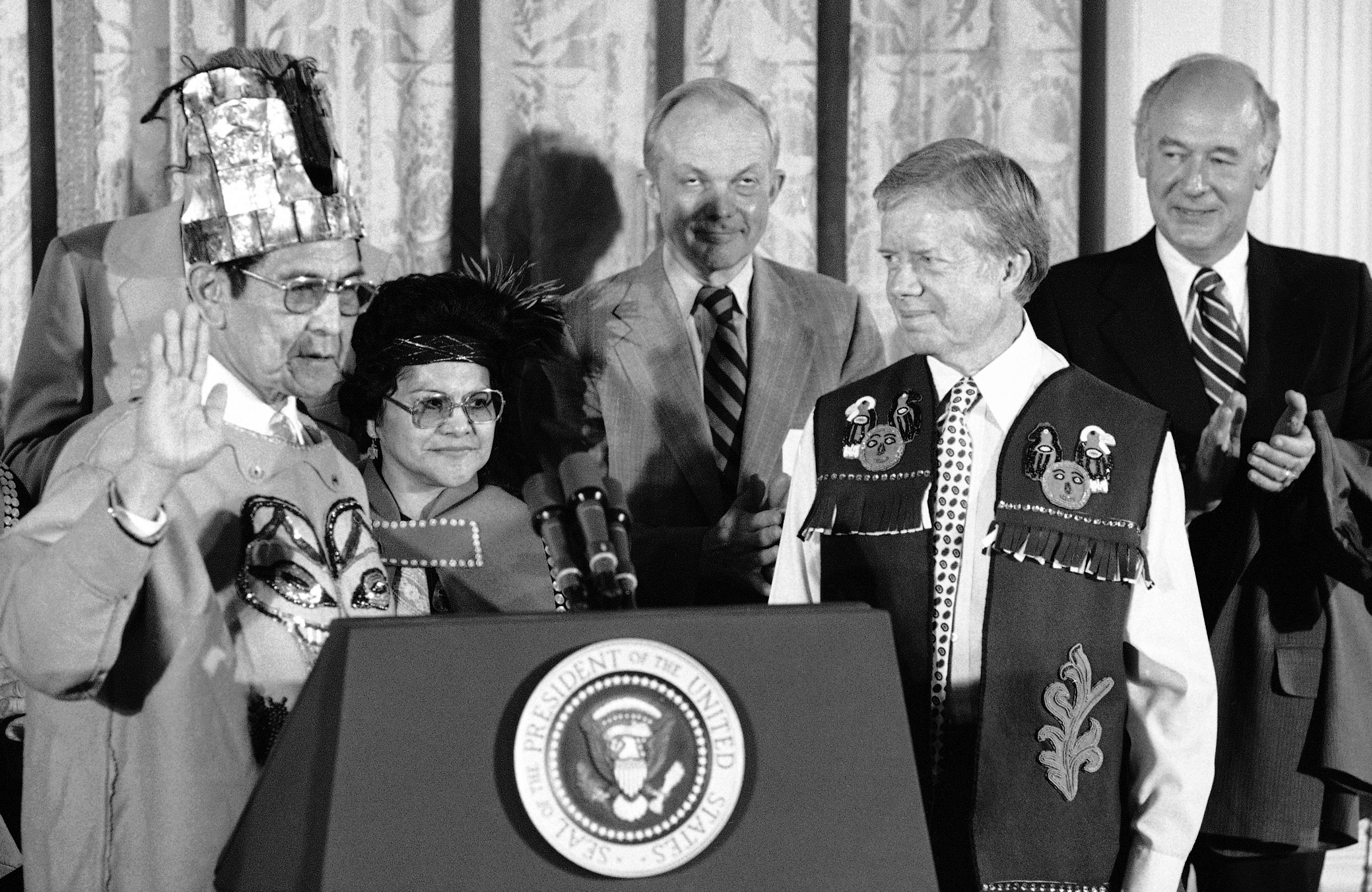 President Jimmy Carter is given the name "Haa Hoo Woo" by Chief Matthew of the Tlingit Indian tribe of Alaska during a White House ceremony in Washington, May 4, 1979. President Jimmy Carter is given the name "Haa Hoo Woo" by Chief Matthew of the Tlingit Indian tribe of Alaska during a White House ceremony in Washington, May 4, 1979.