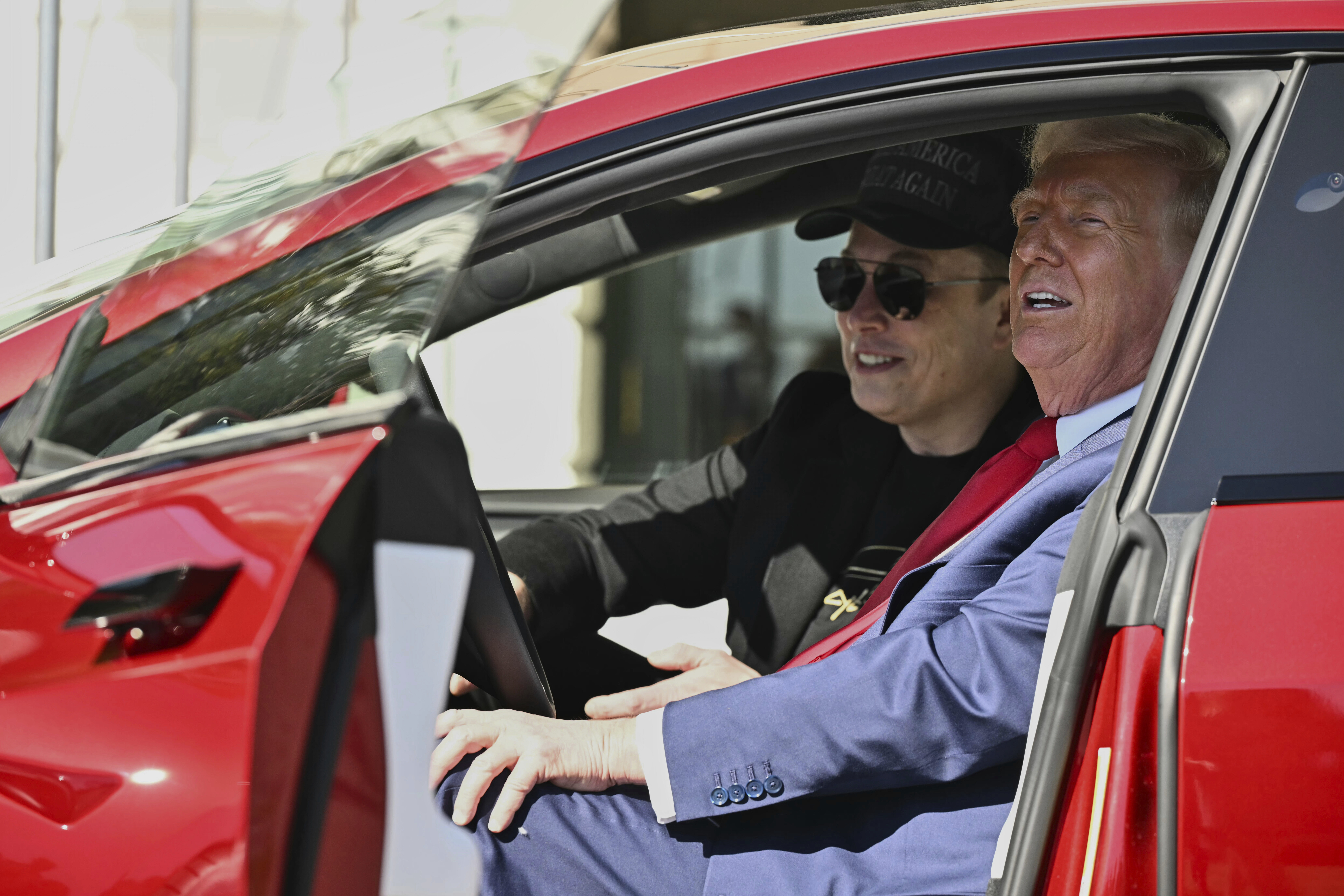 President Donald Trump and Tesla CEO Elon Musk speak to reporters as they sit in a red Model S Tesla vehicle on the South Lawn of the White House. President Donald Trump and Tesla CEO Elon Musk speak to reporters as they sit in a red Model S Tesla vehicle on the South Lawn of the White House.