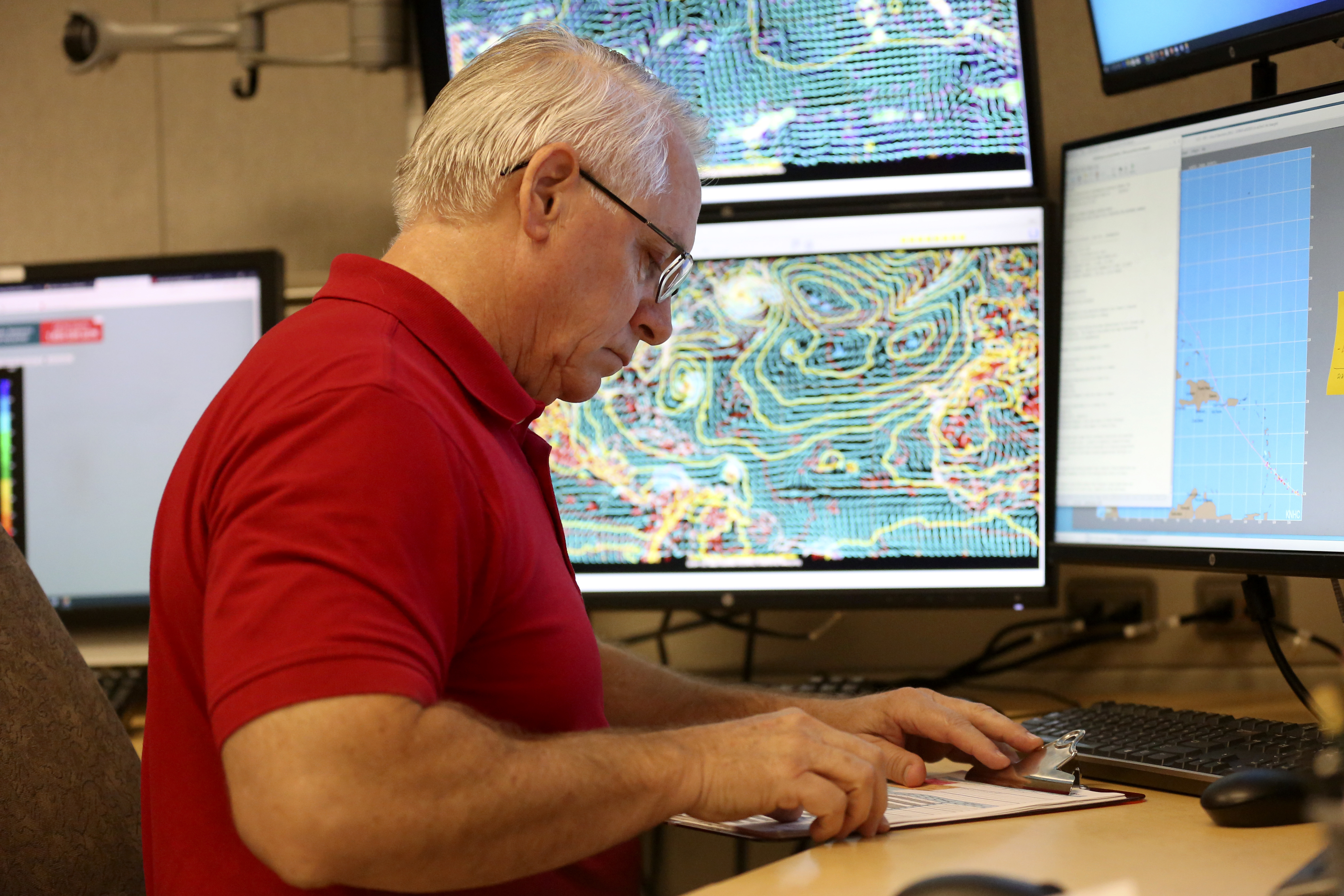Senior hurricane specialist Stacy Stewart monitors the progress of Tropical Storm Dorian at the National Hurricane Center on Aug. 27, 2019. Senior hurricane specialist Stacy Stewart monitors the progress of Tropical Storm Dorian at the National Hurricane Center on Aug. 27, 2019.