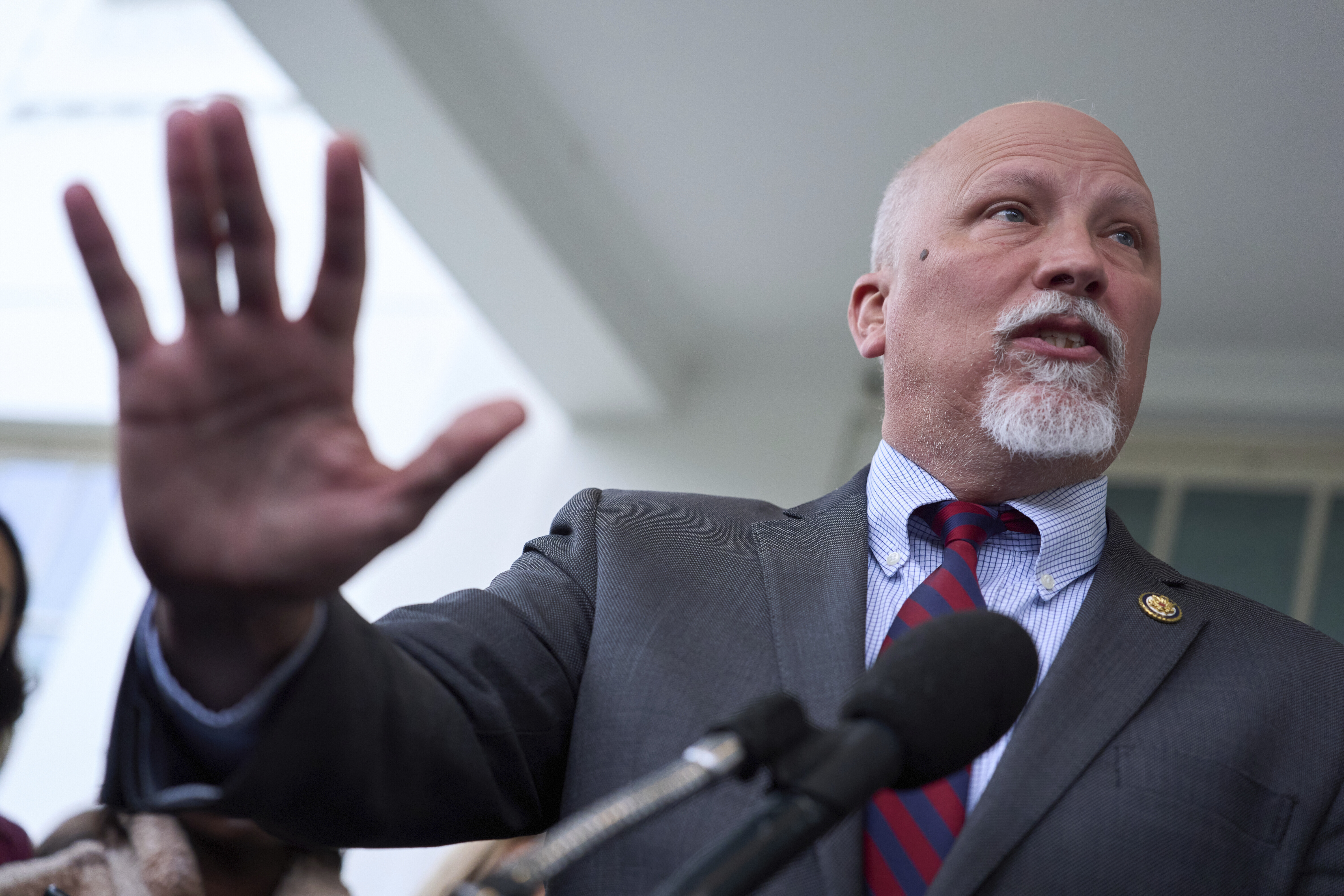 Chip Roy speaking and holding up his hand. 